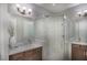 Updated bathroom with a large glass shower and double vanity at 15037 Shady Palms Ln, Nokomis, FL 34275