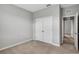 Simple bedroom with double doors leading to an adjacent room at 12354 Nantahala Run, Parrish, FL 34219