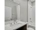 Clean bathroom with a quartz countertop, modern vanity, and a bathtub at 12354 Nantahala Run, Parrish, FL 34219