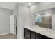 Double vanity bathroom with a large mirror and modern fixtures at 12354 Nantahala Run, Parrish, FL 34219