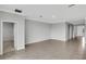 Bright and airy living room with tile floors and neutral color palette at 12354 Nantahala Run, Parrish, FL 34219
