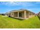Spacious backyard with a covered patio, perfect for outdoor entertaining at 12354 Nantahala Run, Parrish, FL 34219