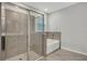Modern bathroom with a walk-in shower and soaking tub at 12354 Nantahala Run, Parrish, FL 34219