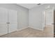 Bedroom with double doors and access to hallway at 12354 Nantahala Run, Parrish, FL 34219
