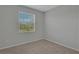 Bright bedroom featuring a window with blinds and neutral wall color at 12354 Nantahala Run, Parrish, FL 34219