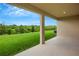 Covered patio with a view of a grassy backyard at 12354 Nantahala Run, Parrish, FL 34219
