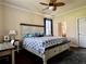 Main bedroom with king-size bed, dresser, and ceiling fan at 135 Sweet Tree St, Bradenton, FL 34212