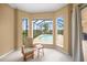 Relaxing sitting area with view of the pool and golf course at 2995 Bravura Lake Dr, Sarasota, FL 34240