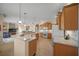 Open concept kitchen with a large island and views into the Gathering room at 2995 Bravura Lake Dr, Sarasota, FL 34240