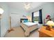 Bedroom with a queen-size bed and plenty of natural light at 2995 Bravura Lake Dr, Sarasota, FL 34240