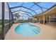 Private kidney-shaped pool with a screened enclosure at 2995 Bravura Lake Dr, Sarasota, FL 34240