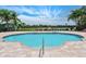 Relaxing kidney-shaped community pool with a tranquil lake view at 2995 Bravura Lake Dr, Sarasota, FL 34240