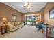 Living room with sliding doors leading to the pool area at 2995 Bravura Lake Dr, Sarasota, FL 34240