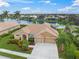 Single-Gathering house with a two-car garage and a landscaped yard at 2995 Bravura Lake Dr, Sarasota, FL 34240