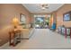 Comfortable living room with sliding doors to pool area at 2995 Bravura Lake Dr, Sarasota, FL 34240