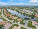 Aerial view of single Gathering home on a lake at 2995 Bravura Lake Dr, Sarasota, FL 34240