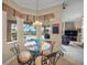 Breakfast nook with a view of the pool and golf course at 2995 Bravura Lake Dr, Sarasota, FL 34240