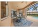Enjoy dining al fresco on the covered patio, overlooking the pool at 2995 Bravura Lake Dr, Sarasota, FL 34240