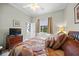 Spacious bedroom with a king-size bed and a view at 2995 Bravura Lake Dr, Sarasota, FL 34240