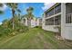 Backyard with palm trees and a view at 1026 Bird Bay Way # 276, Venice, FL 34285