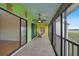 Enclosed porch with tile floors, ceiling fan, and access to interior at 1026 Bird Bay Way # 276, Venice, FL 34285
