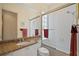 Clean bathroom with granite countertop and updated fixtures at 5679 Ferrara Dr, Sarasota, FL 34238