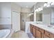 Spacious bathroom with double sinks, soaking tub, and walk-in shower at 9019 Heritage Sound Dr, Bradenton, FL 34212
