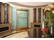 Elegant clubhouse lobby with a water feature and seating at 9019 Heritage Sound Dr, Bradenton, FL 34212