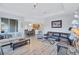 Open concept living room and kitchen with hardwood floors at 9019 Heritage Sound Dr, Bradenton, FL 34212
