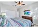 Spacious bedroom with king-size bed and mounted TV at 9019 Heritage Sound Dr, Bradenton, FL 34212
