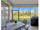 Relaxing screened patio with table, chairs, and grill at 9019 Heritage Sound Dr, Bradenton, FL 34212
