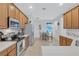Spacious kitchen with stainless steel appliances and ample cabinetry at 9019 Heritage Sound Dr, Bradenton, FL 34212