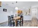 Dining area with granite-top table and four chairs, near kitchen at 9019 Heritage Sound Dr, Bradenton, FL 34212