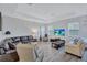 Spacious living room with a leather sectional sofa and large TV at 9019 Heritage Sound Dr, Bradenton, FL 34212