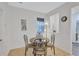 Charming breakfast nook with a round table and four chairs at 9019 Heritage Sound Dr, Bradenton, FL 34212