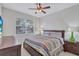 Bright bedroom with a king-size bed and ceiling fan at 9019 Heritage Sound Dr, Bradenton, FL 34212