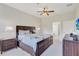Spacious main bedroom with king bed and ensuite bathroom access at 9019 Heritage Sound Dr, Bradenton, FL 34212