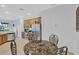 Kitchen nook with a round table and four chairs, perfect for casual dining at 9019 Heritage Sound Dr, Bradenton, FL 34212