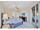 Bright main bedroom with king-size bed and access to en-suite bathroom at 9019 Heritage Sound Dr, Bradenton, FL 34212