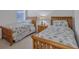Bedroom with two twin beds, nightstand, and window at 9019 Heritage Sound Dr, Bradenton, FL 34212