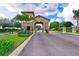 Gated entrance to a community with stonework and lush landscaping at 9019 Heritage Sound Dr, Bradenton, FL 34212