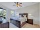 Spacious main bedroom with king-size bed and private access to balcony at 9019 Heritage Sound Dr, Bradenton, FL 34212