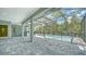 Spacious pool and patio area with a screened enclosure at 12420 Destin Loop, Venice, FL 34293