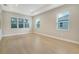 Light-filled bedroom with wood-look flooring and neutral walls at 12420 Destin Loop, Venice, FL 34293