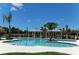 Large community pool with shaded cabanas and plenty of space to lounge at 12420 Destin Loop, Venice, FL 34293