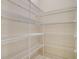 Bright walk-in pantry with ample shelving for storage at 12420 Destin Loop, Venice, FL 34293