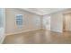 Spacious bedroom with wood flooring and access to bathroom at 12420 Destin Loop, Venice, FL 34293