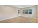 Bright bedroom featuring wood-look floors and large windows at 12420 Destin Loop, Venice, FL 34293