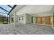 Spacious covered patio with pavers and pool view at 12420 Destin Loop, Venice, FL 34293