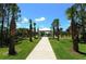 White gazebo with a walkway and palm trees at 12420 Destin Loop, Venice, FL 34293